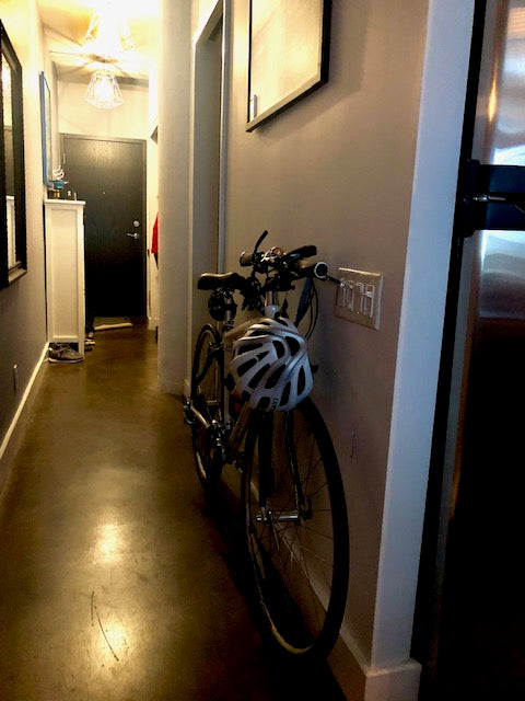 Specialized Sirrus against wall condo hallway with Revelo THINstem
