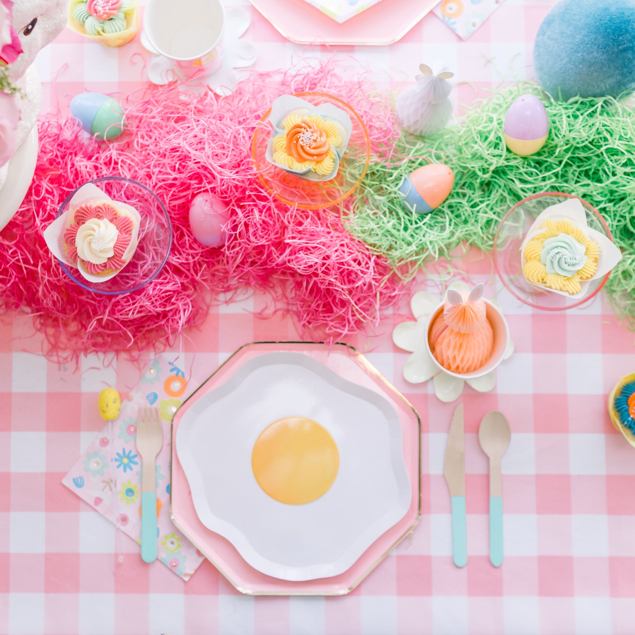 Easter table setting ideas using an egg yolk plate and plaid party supplies. 