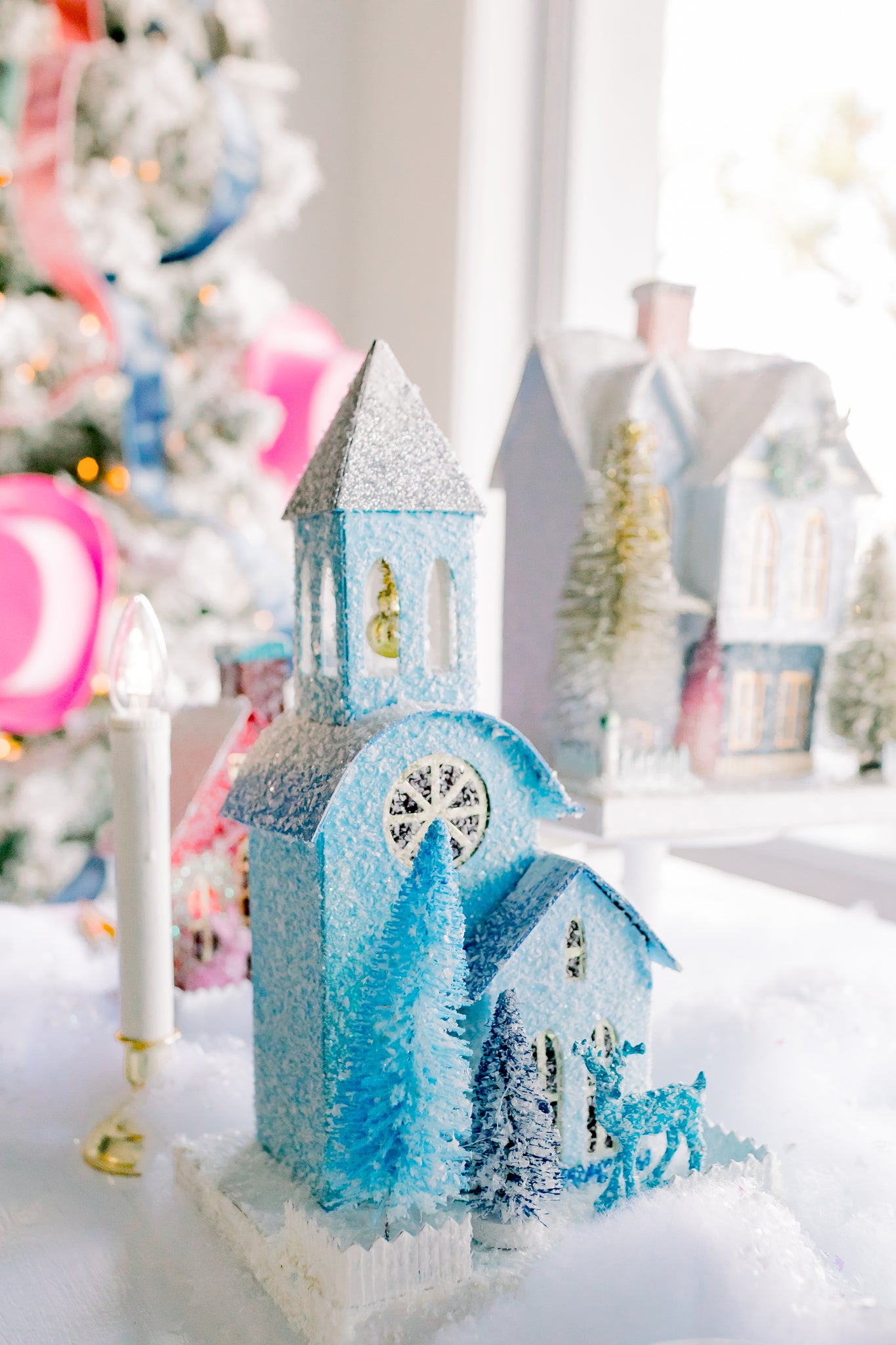 Mini Christmas church in a darling festive village.
