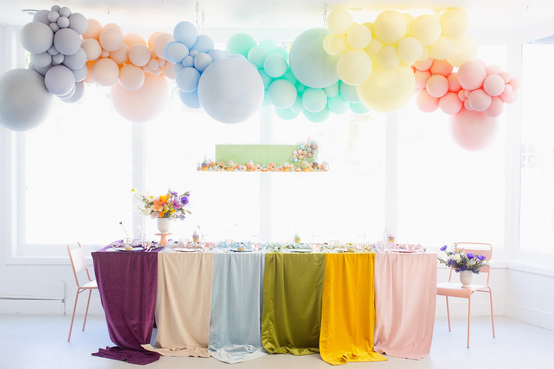 Pastel rainbow party decorations.