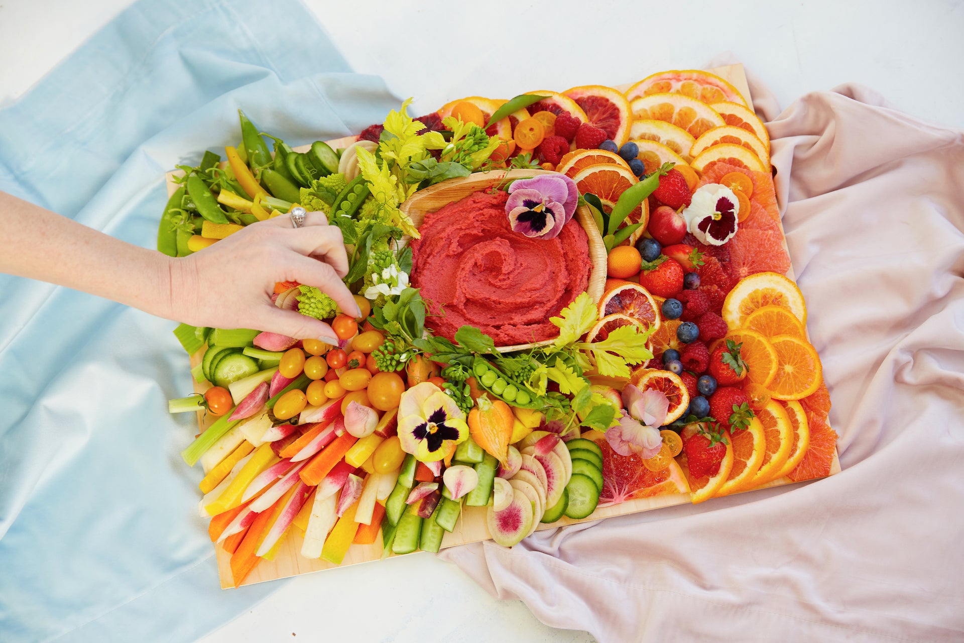 Rainbow fruit and vegetable charcuterie board.