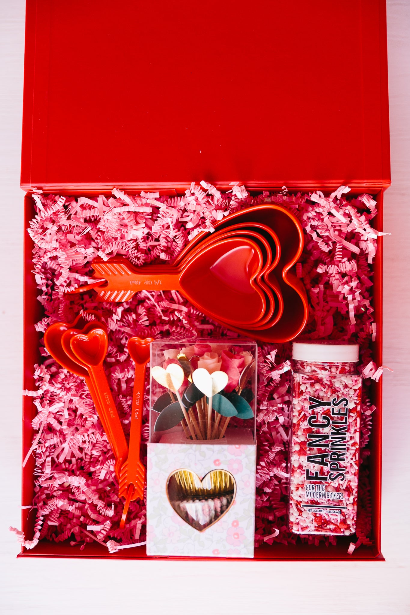 Heart shaped baking supplies and sprinkles as a Valentine's Day gift idea
