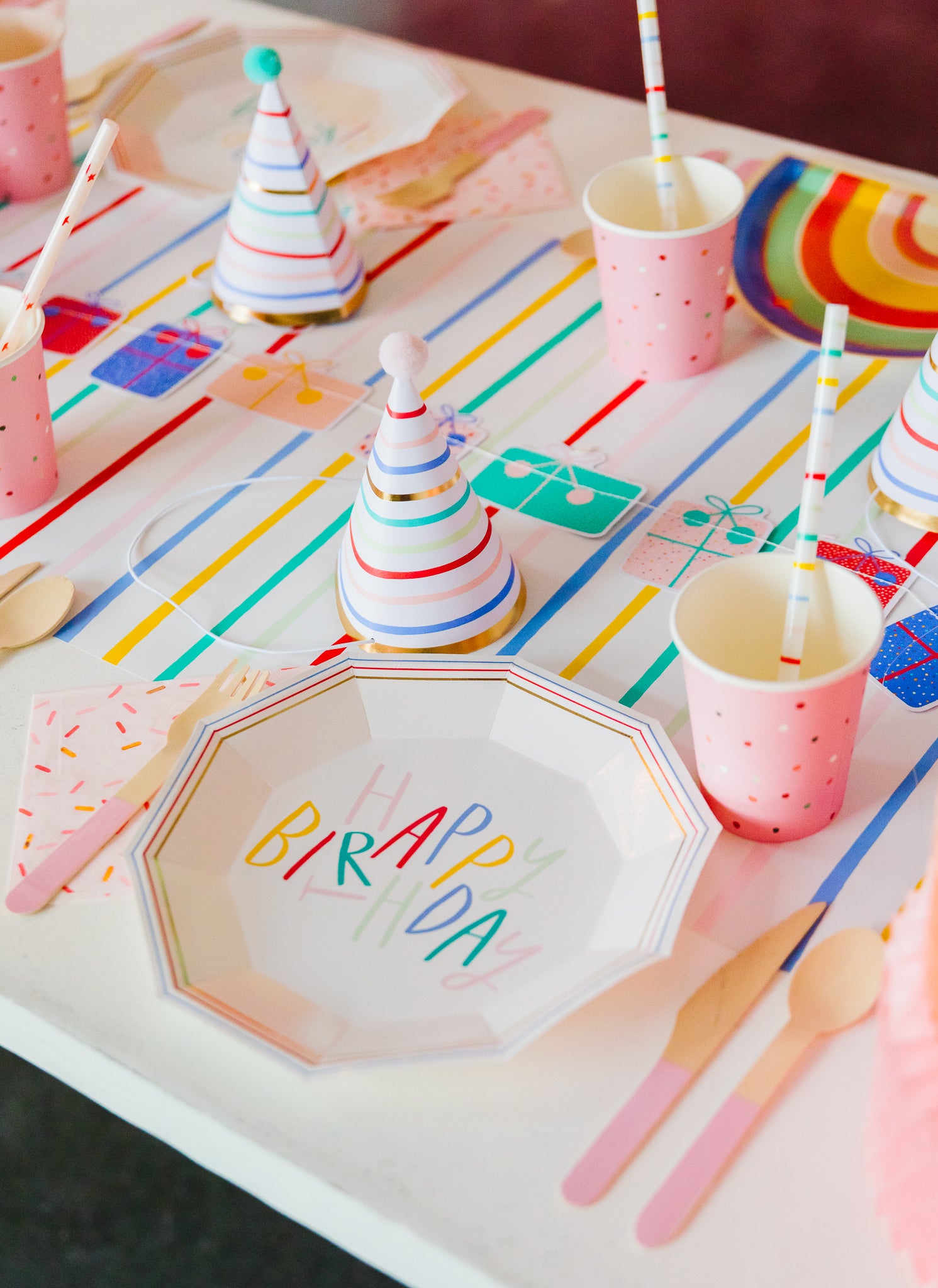 Rainbow themed birthday party supplies and tableware. 