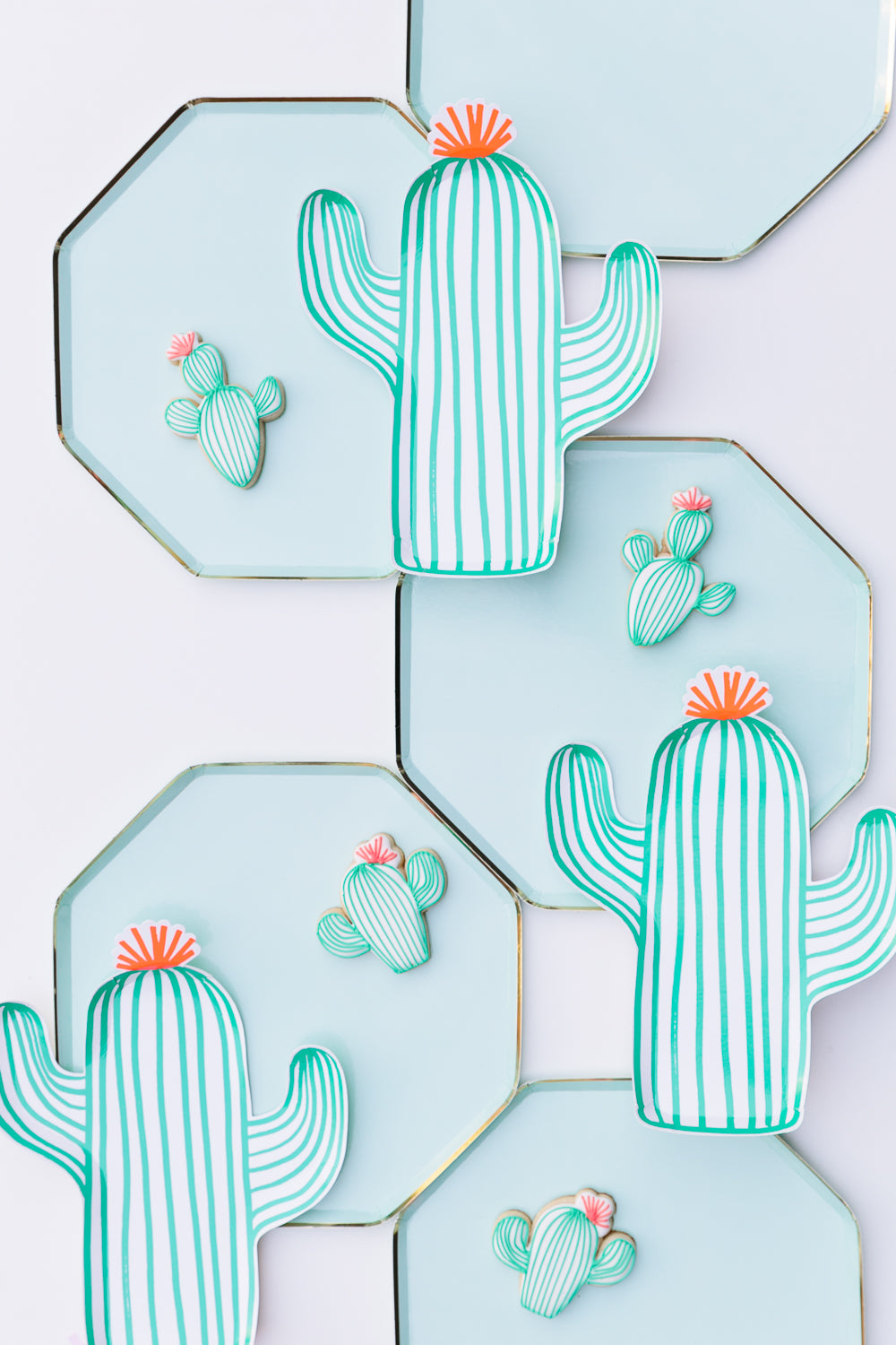 Green cactus plates and other tableware for a Cinco de Mayo party.