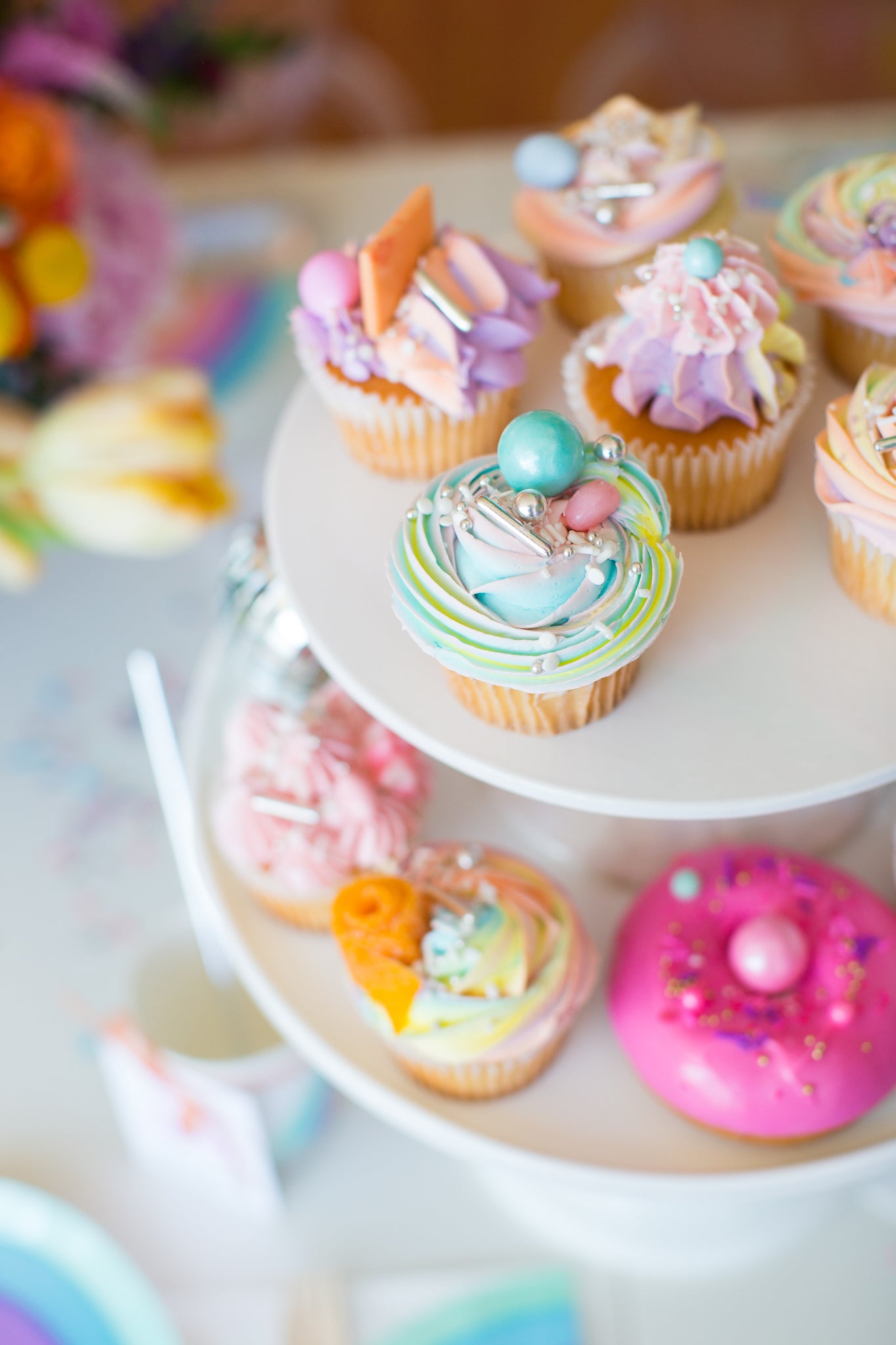 Rainbow cupcakes for a fun rainbow party dessert idea.