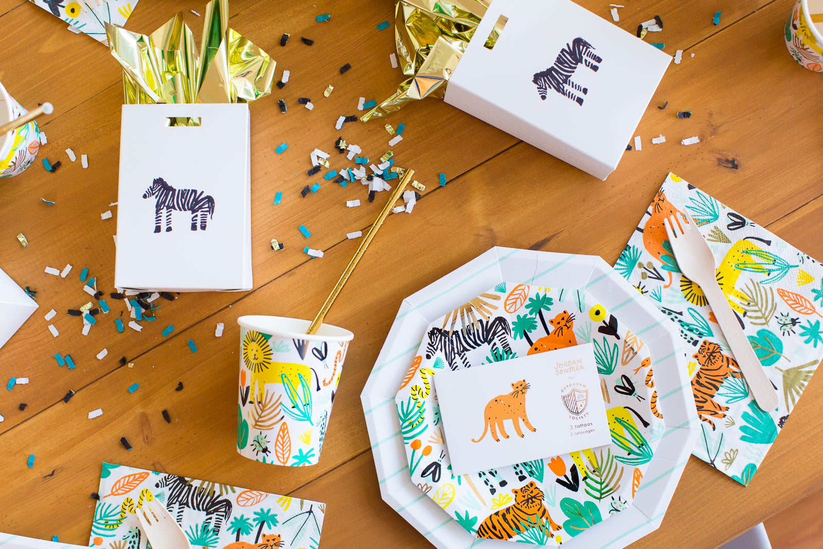 Jungle theme party supplies for a safari party table setting.