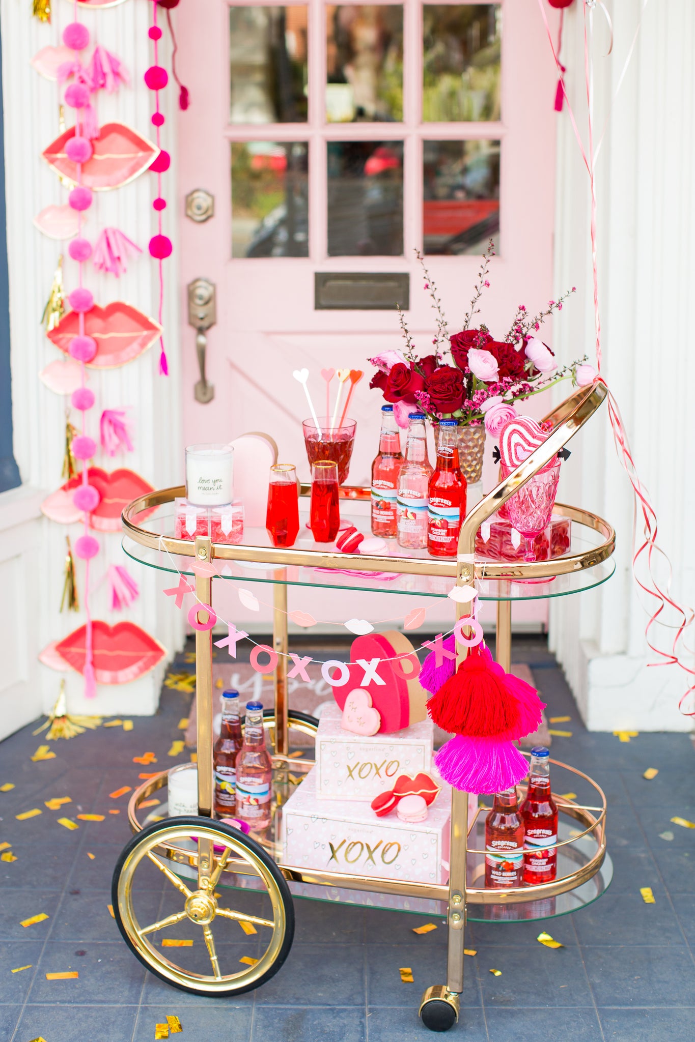 Hot pink and red decorations on a bar cart for Valentine's Day