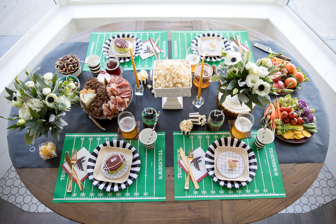 Football themed party supplies and tableware for a Super Bowl party