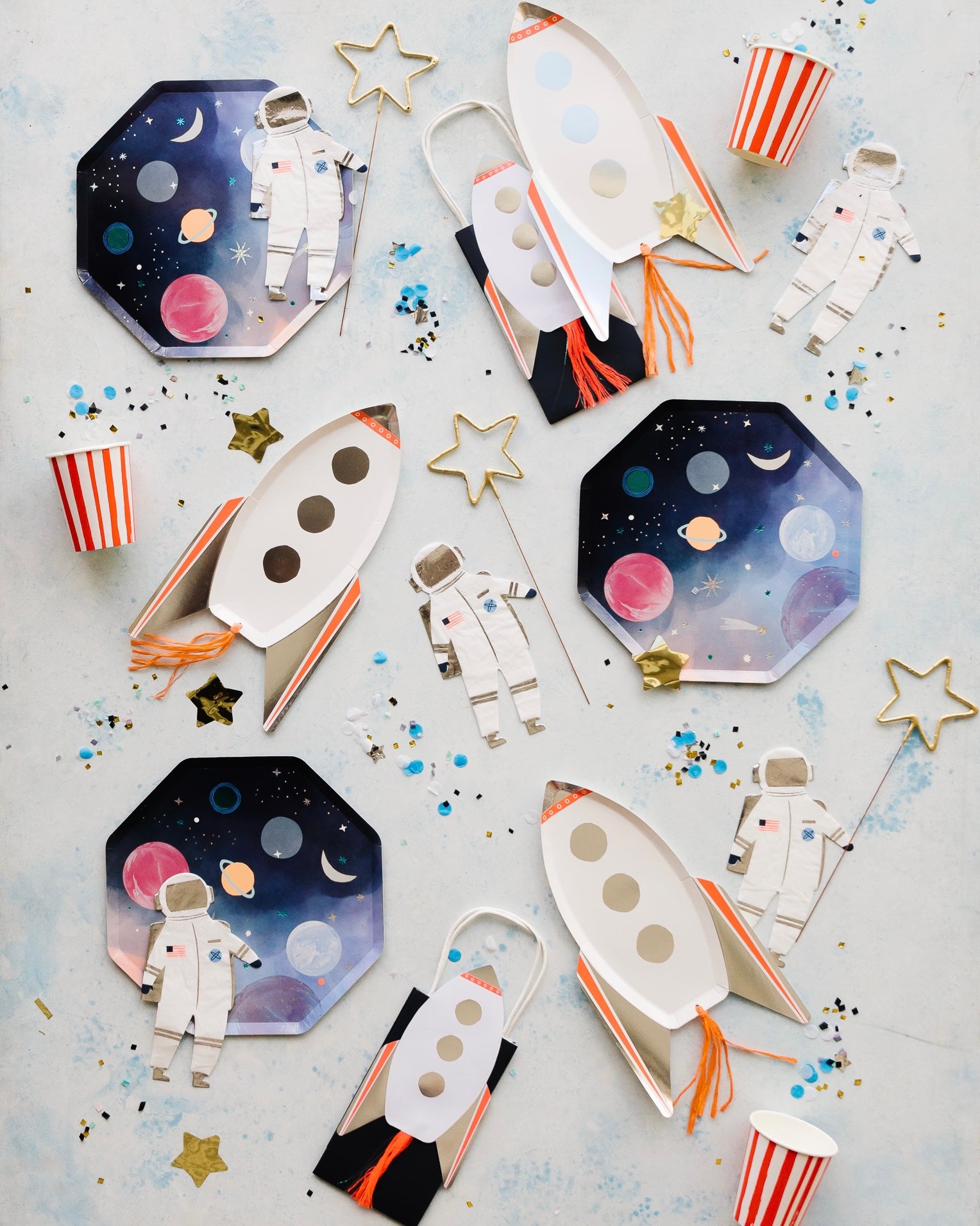 Space-themed party supplies set out for a kid's birthday party.