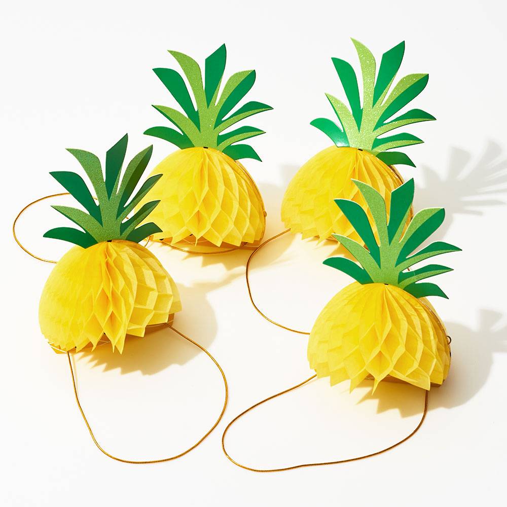 Pineapple honeycomb party hats for a Summer party. 