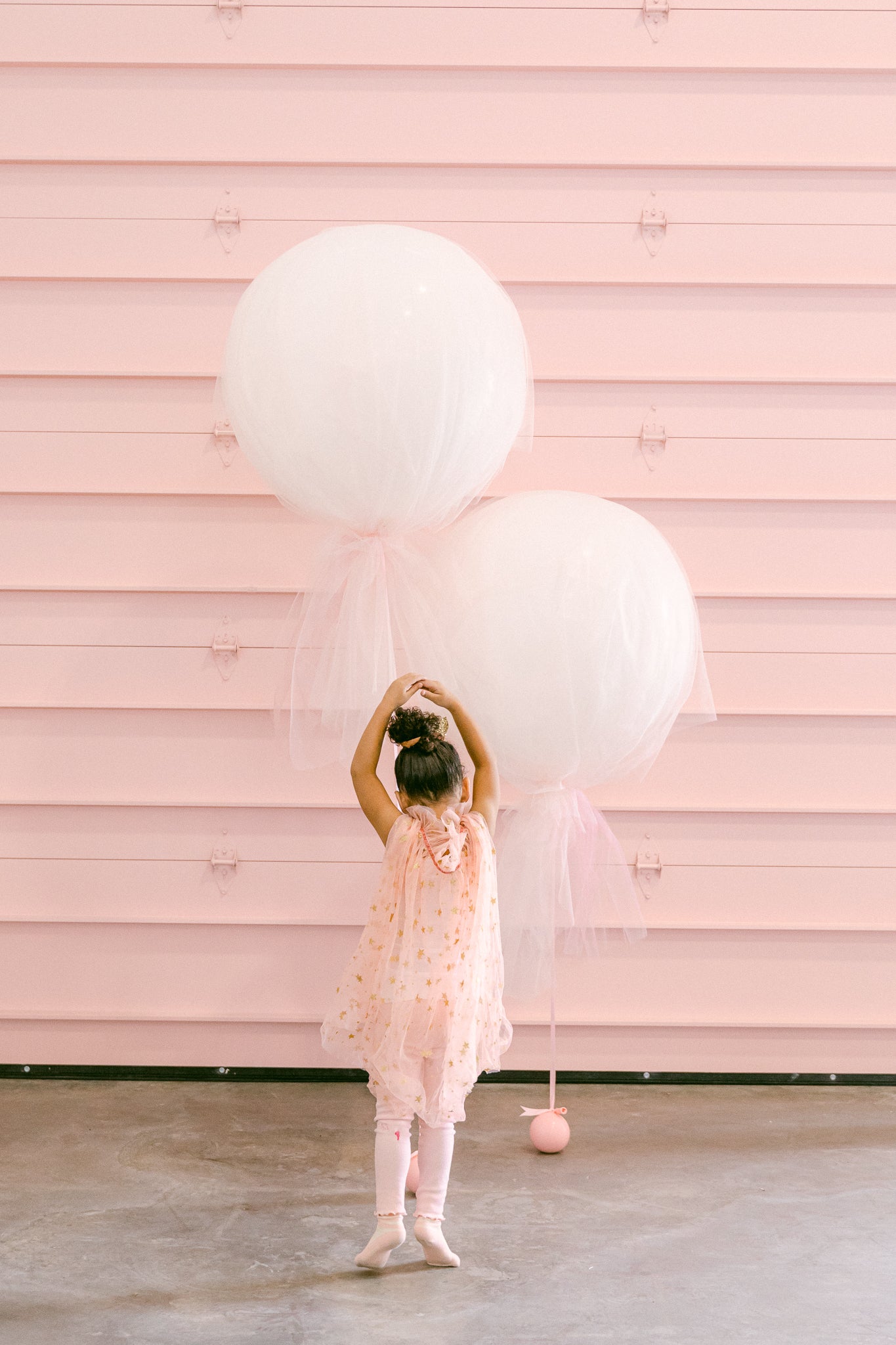 Pink tulle balloons at a little girl's ballerina birthday party.