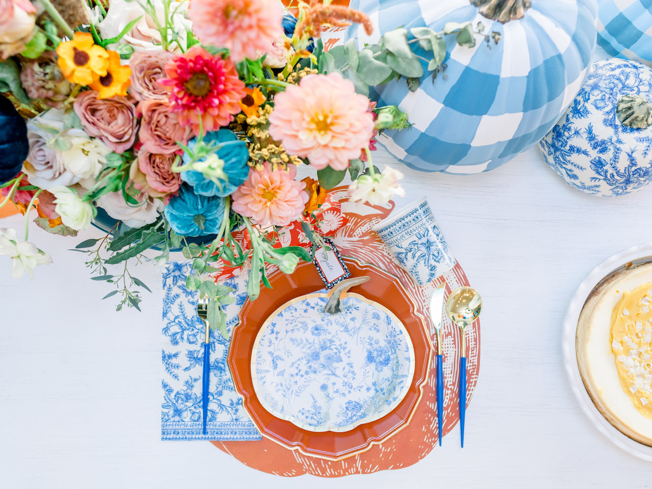 Thanksgiving place setting with blue toile pumpkin plates.