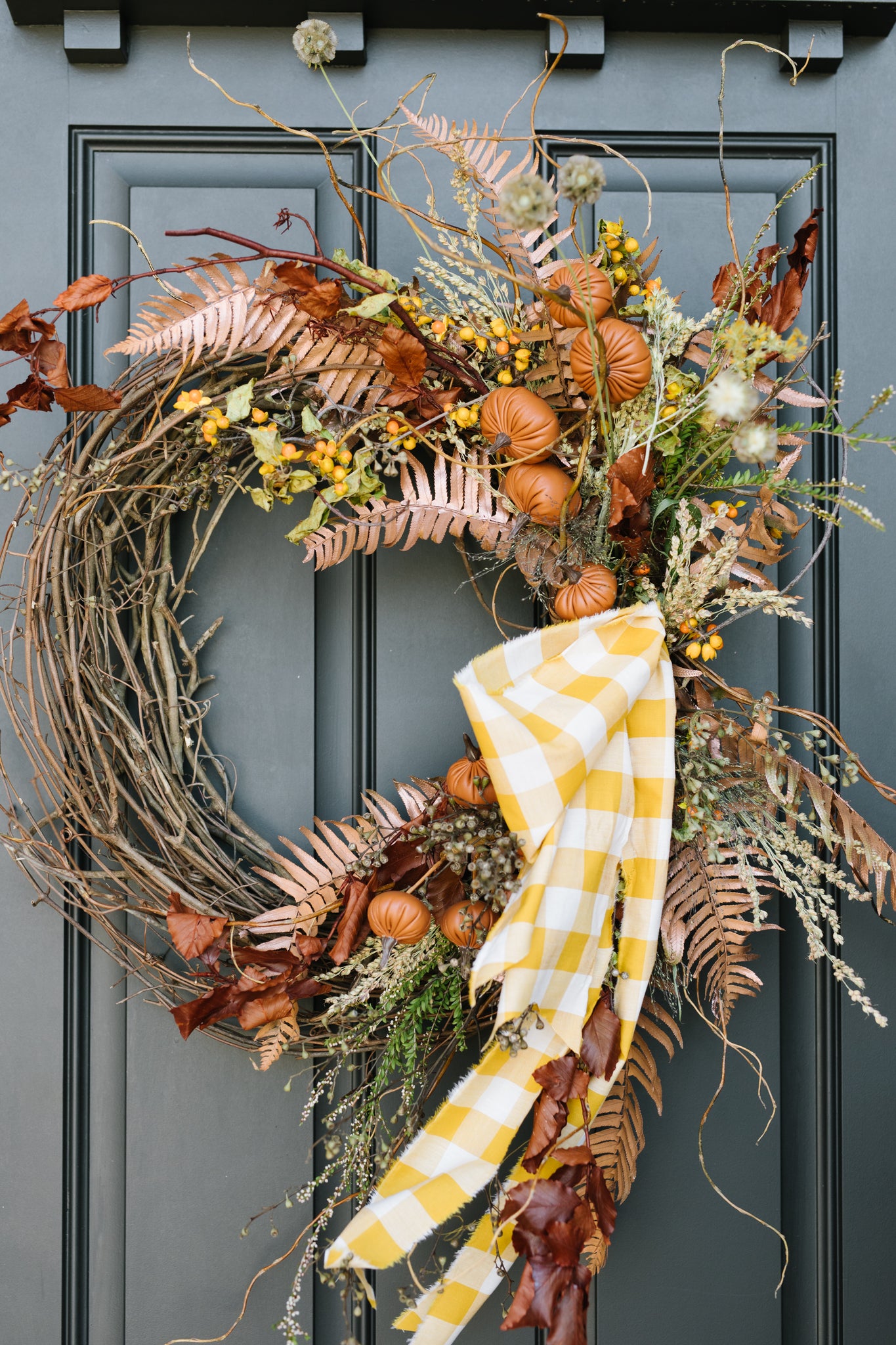 Fall wreaths on front door.