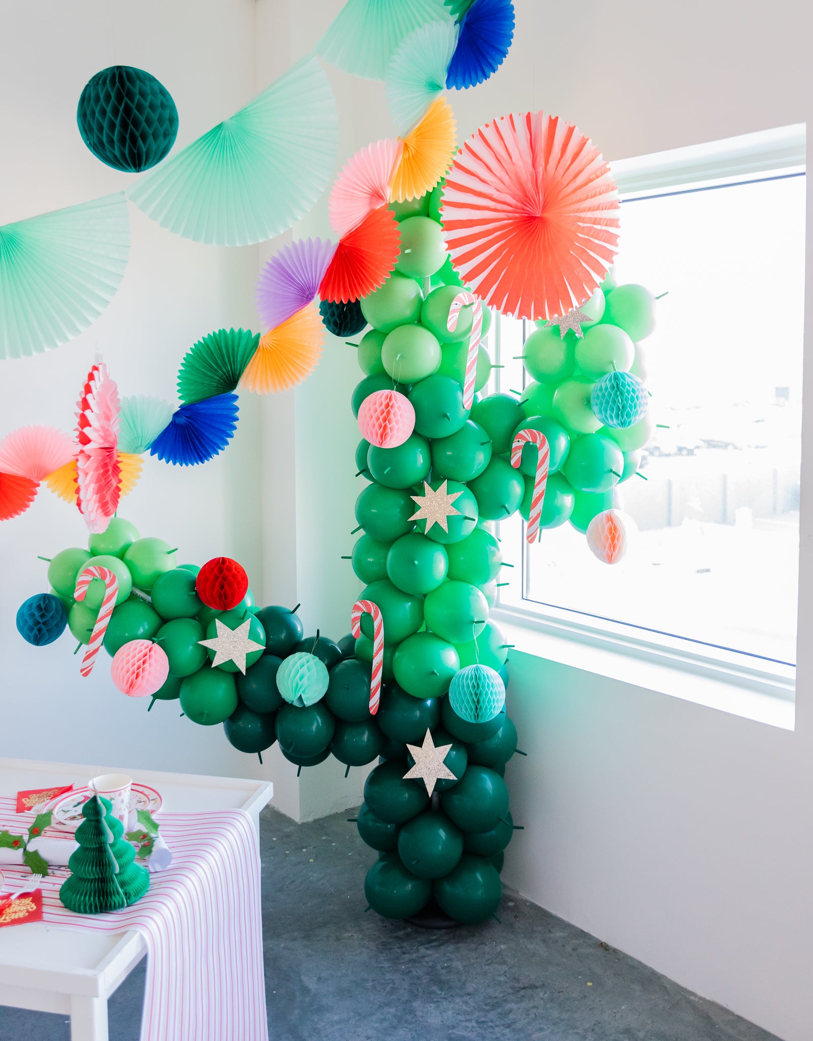 Cactus Christmas tree balloon decoration for a cowboy-themed holiday party.
