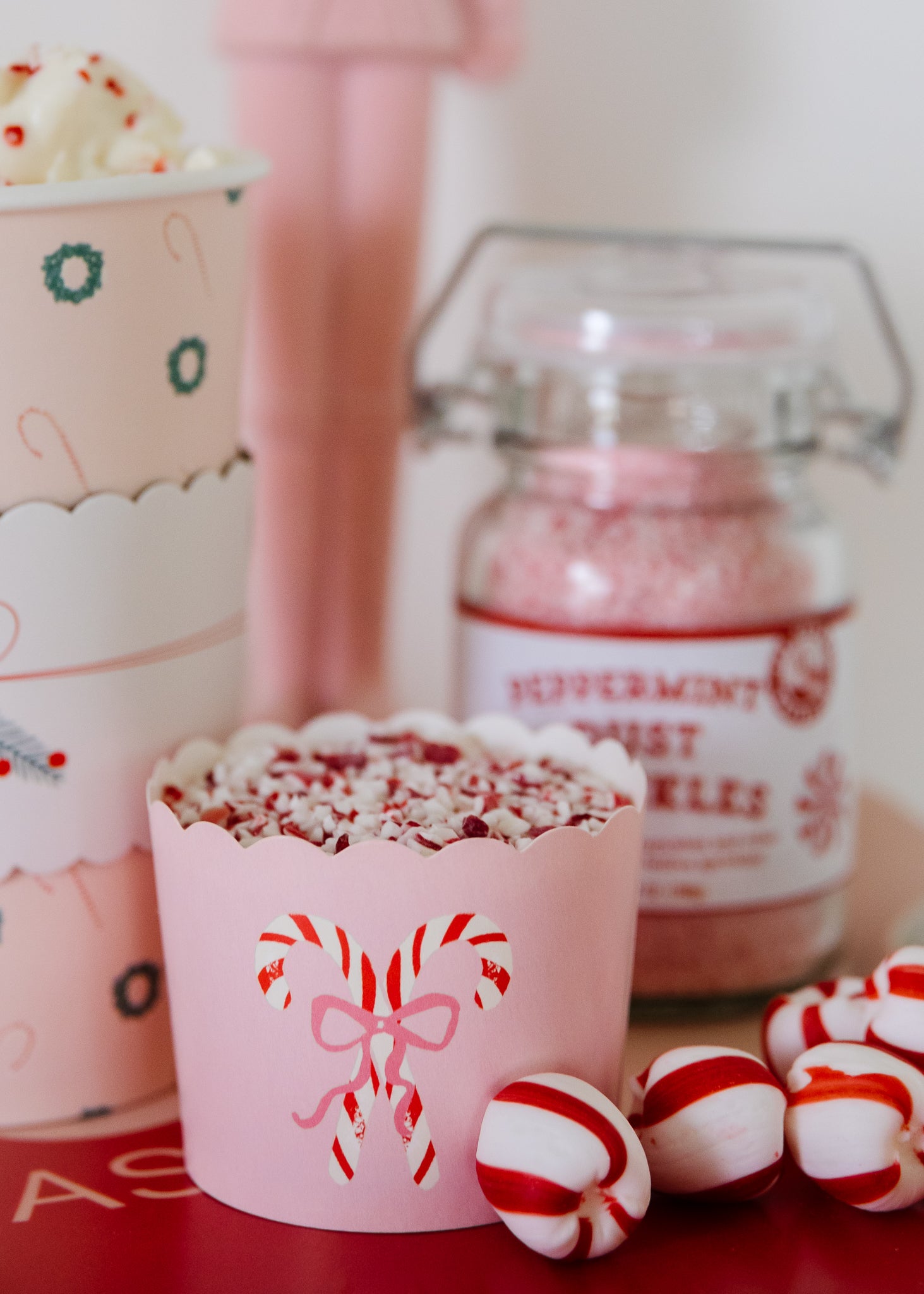 Peppermint flakes in a peppermint-themed food cup for a Christmas hot chocolate bar. 