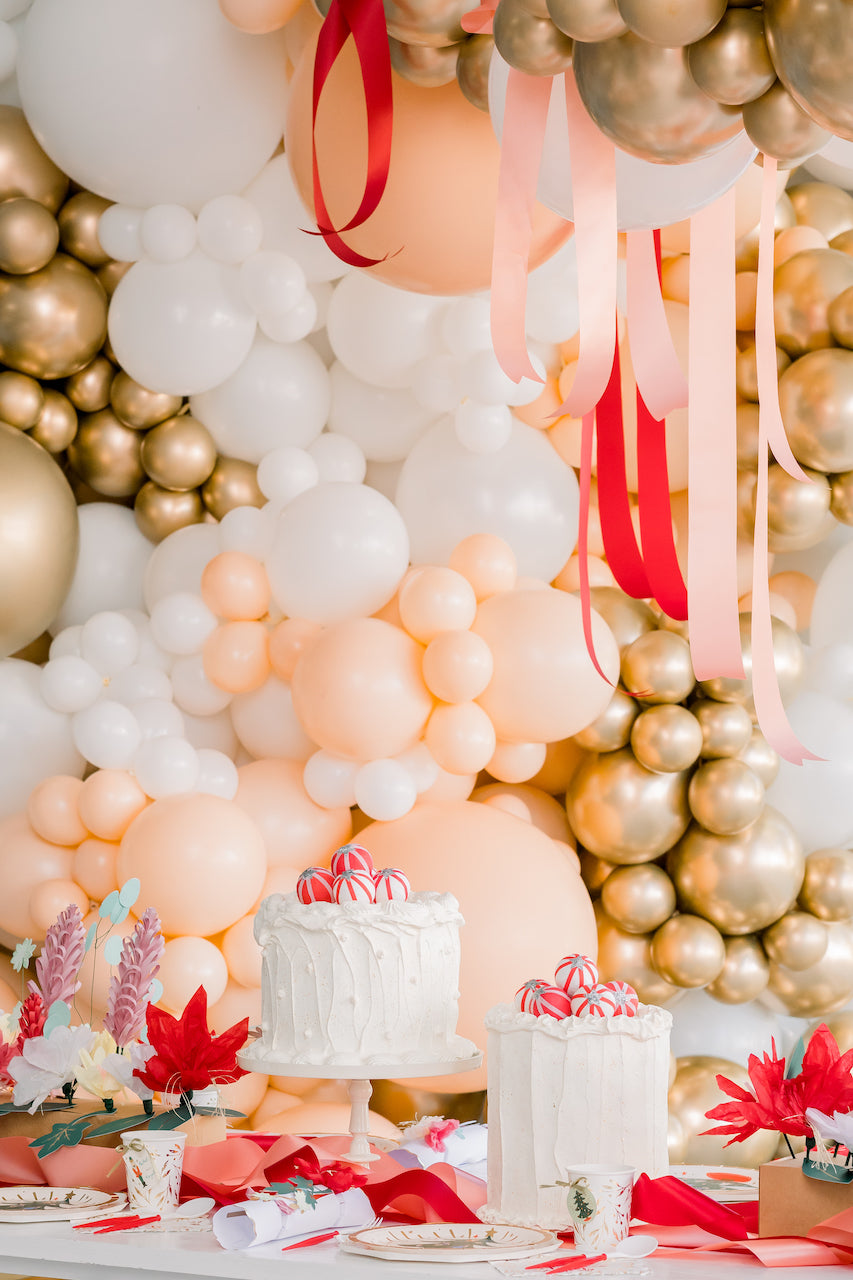 Neutral balloon backdrop for a Nutcracker themed Christmas party.