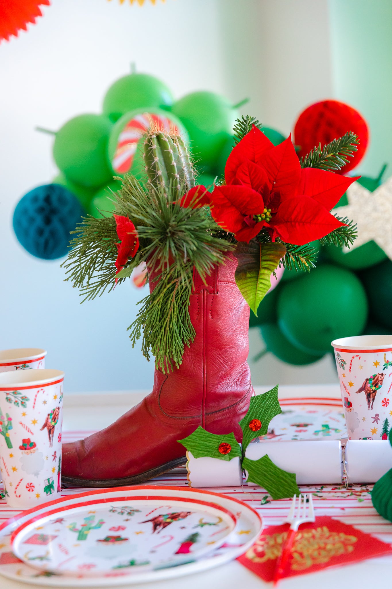 Cowboy Christmas centerpiece ideas using flowers and cowboy boots.