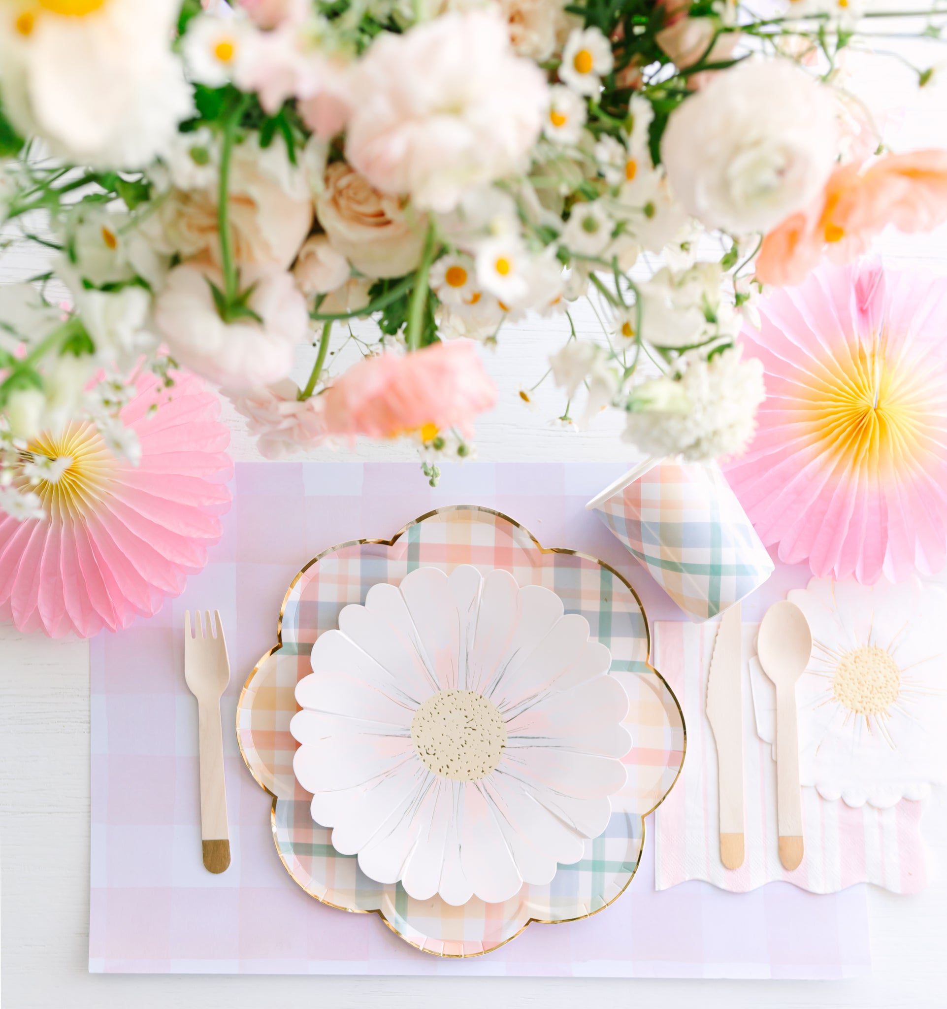 Daisy party plates displayed with other Daisy theme party supplies.