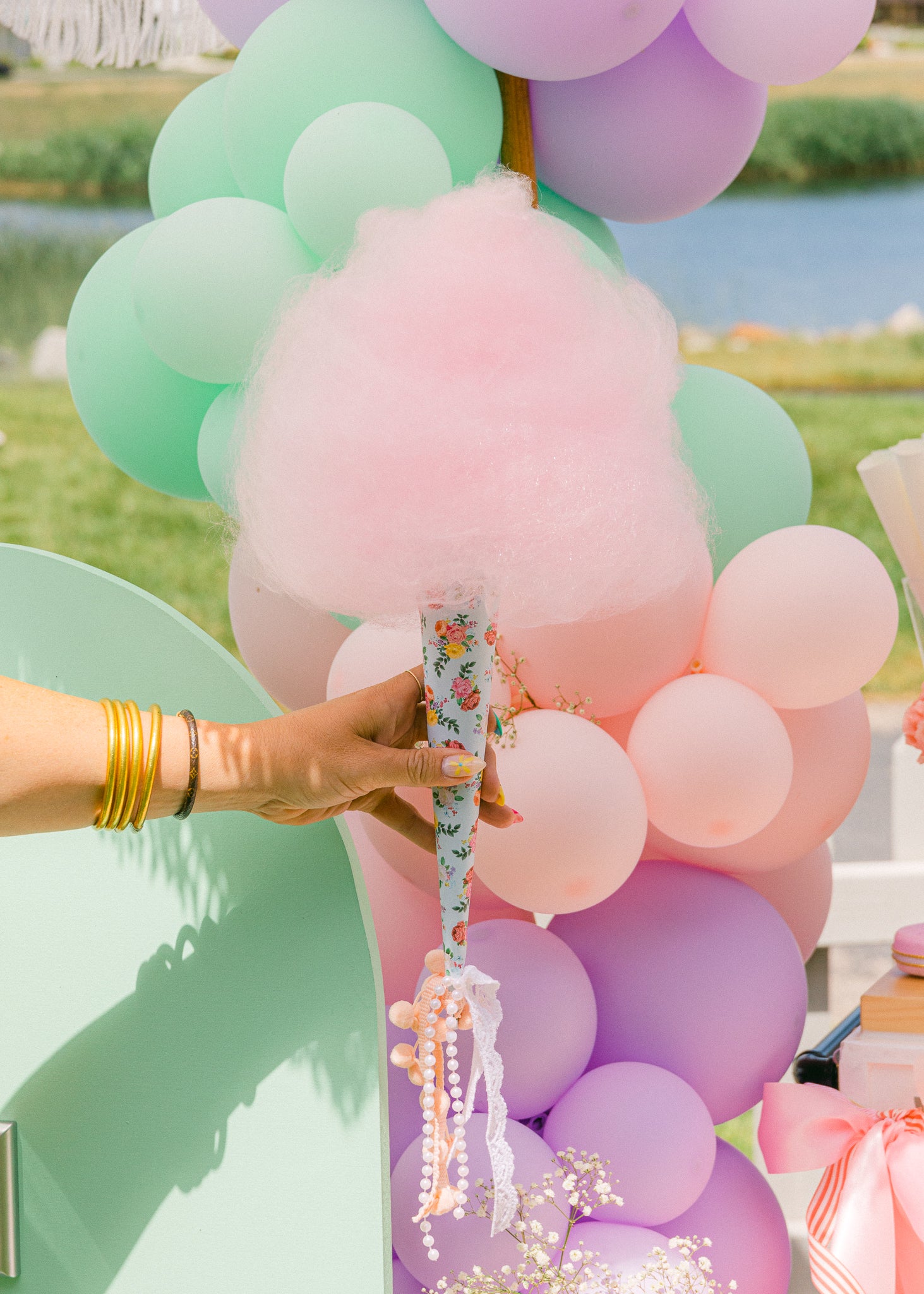 Cotton candy wrapped in a floral print cone as a fun tea party birthday treat. 