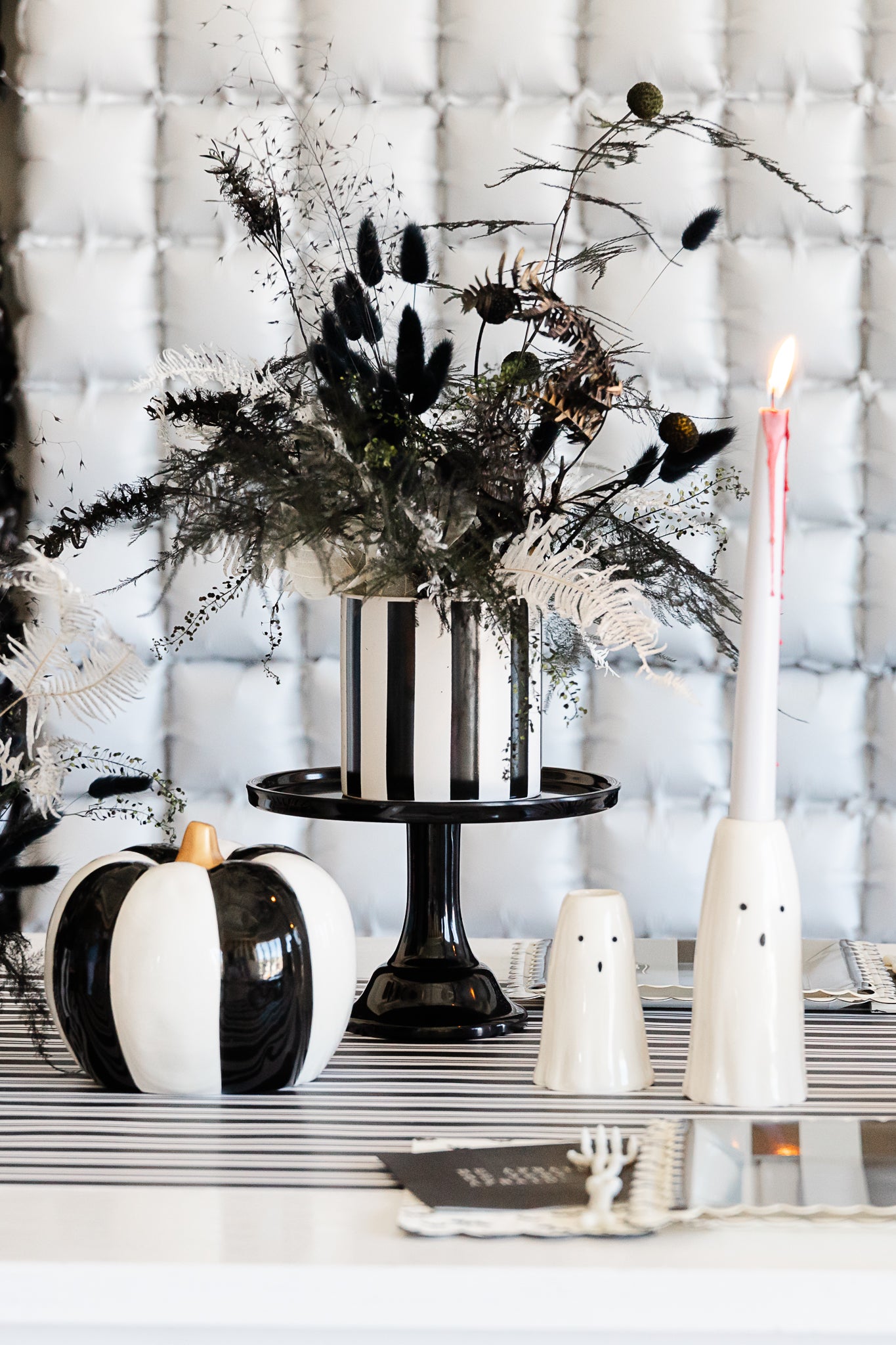 Ghost candle holders for a Wednesday-themed Halloween party.