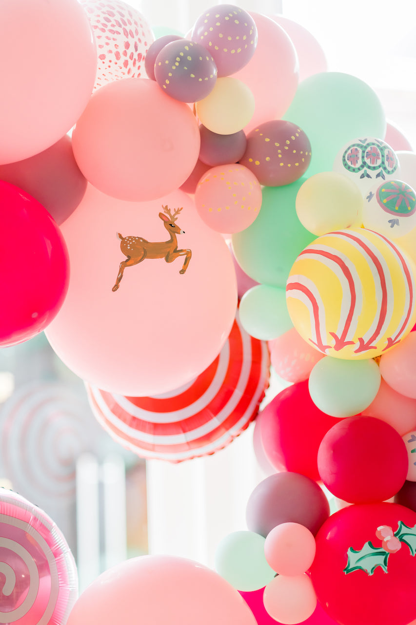 Hand painted balloons with deer and ornaments.