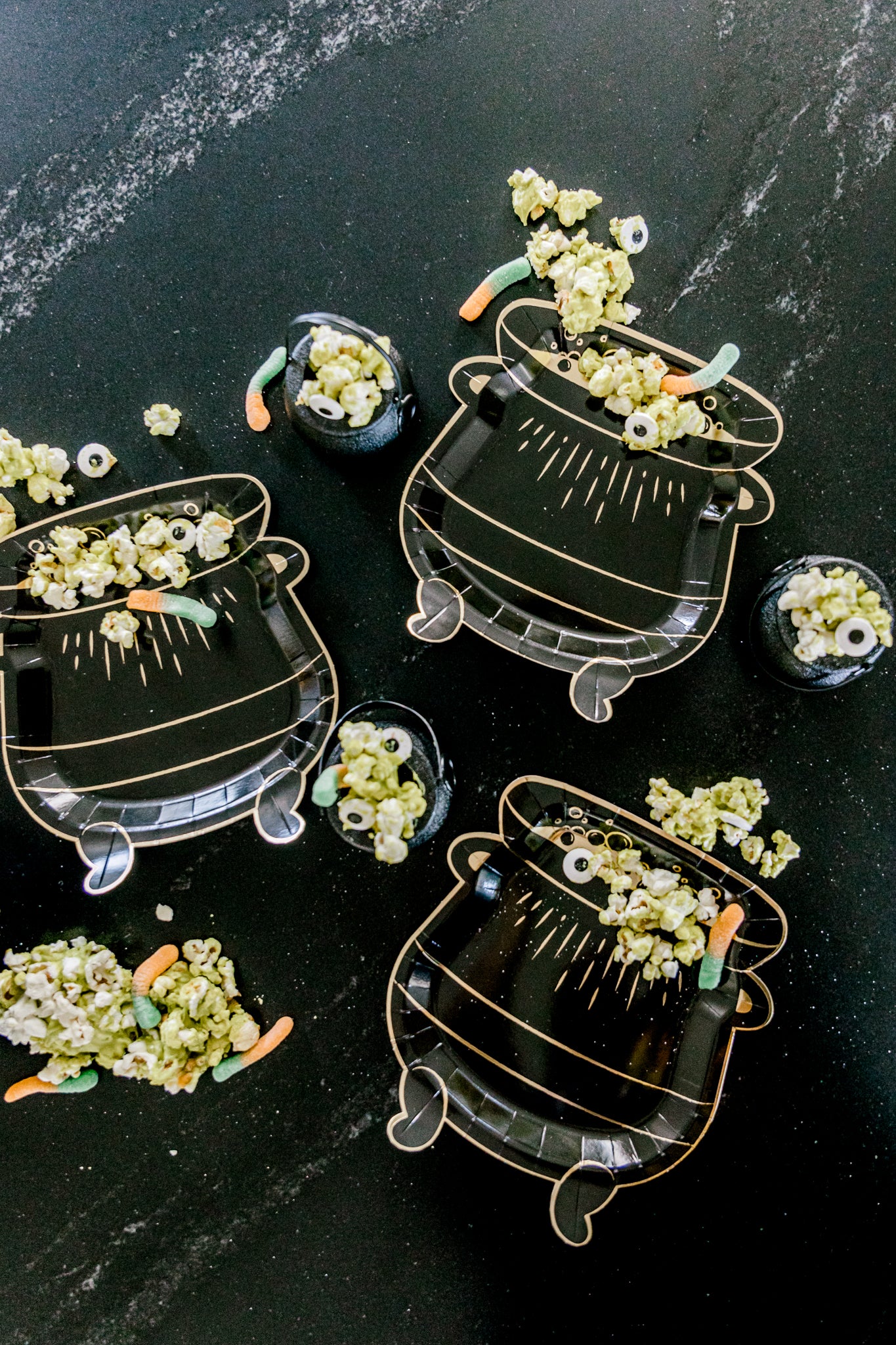 Cauldron plates with candy and popcorn