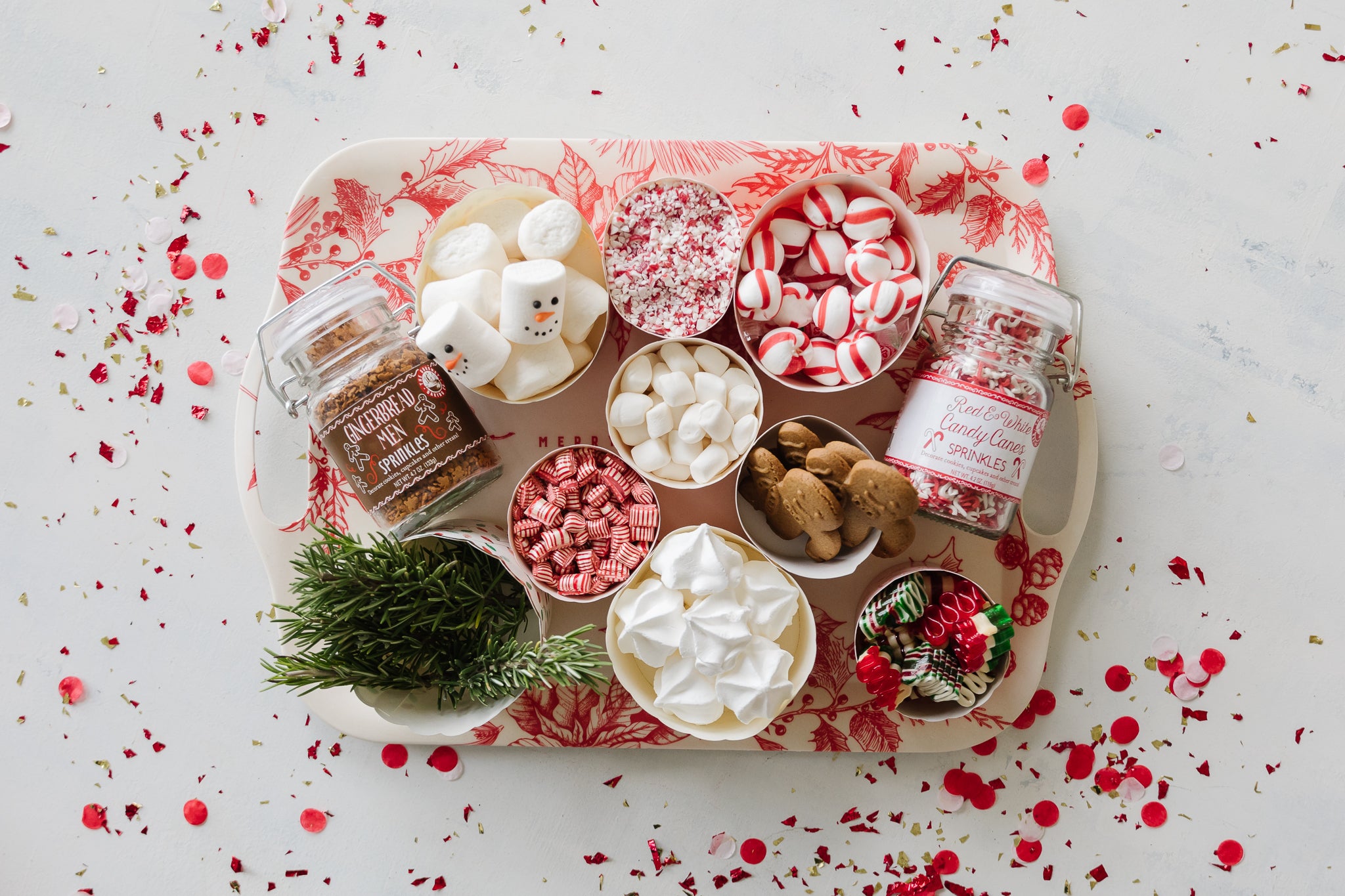 Hot chocolate toppings displayed on a Christmas tray.