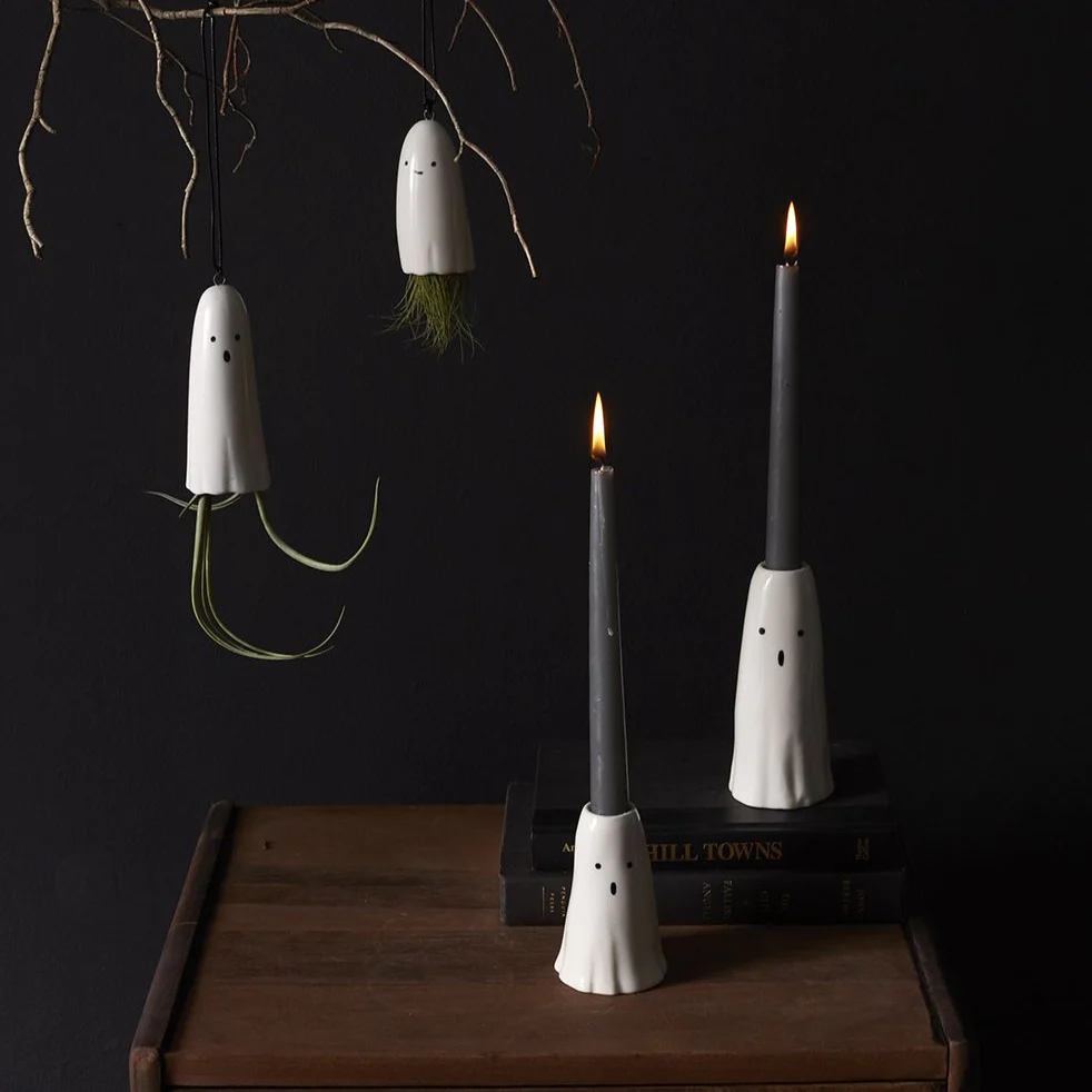 Ghost candlesticks as Halloween decorations.