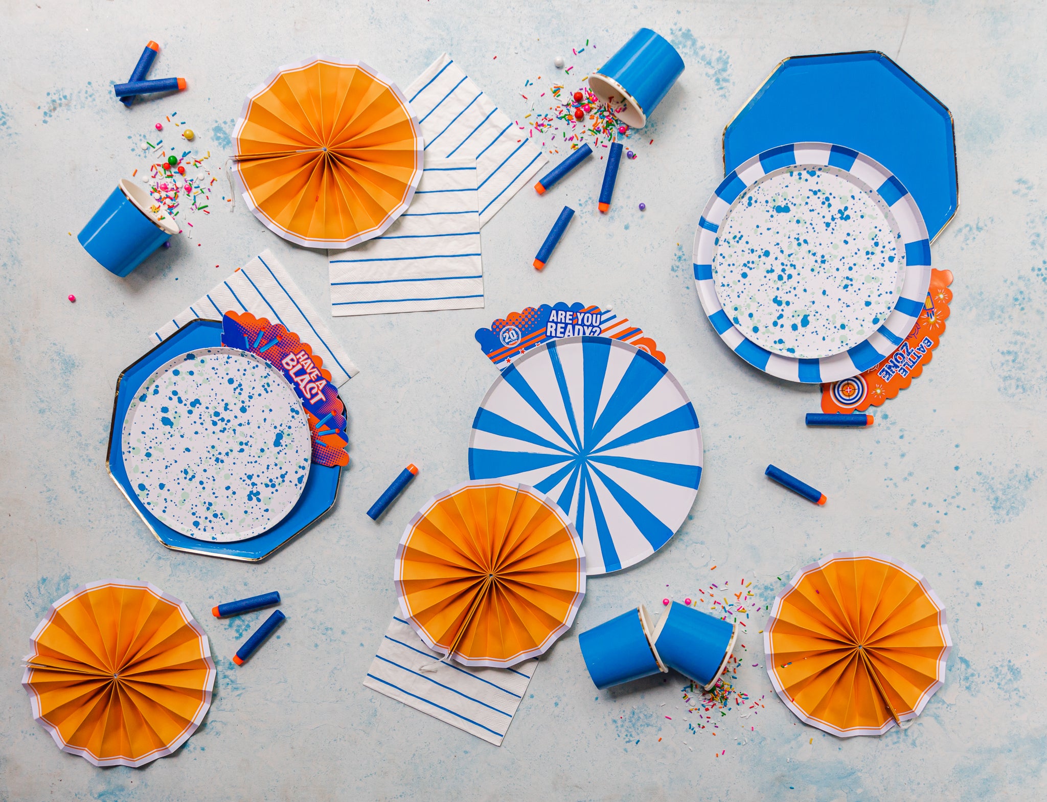 Blue and orange tableware for a Nerf-themed birthday party.