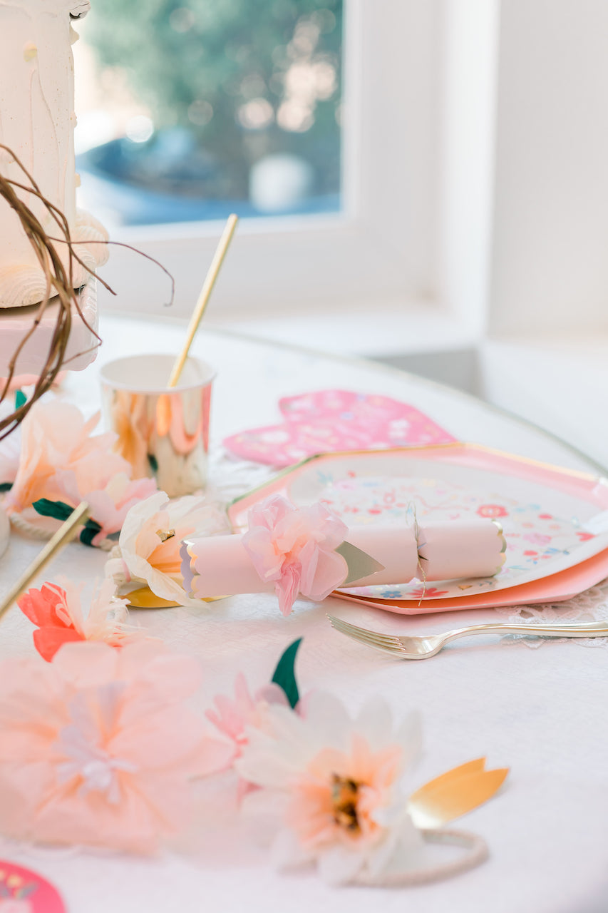 Pink flower party crackers as a fun party favor for a Valentine's Day party.