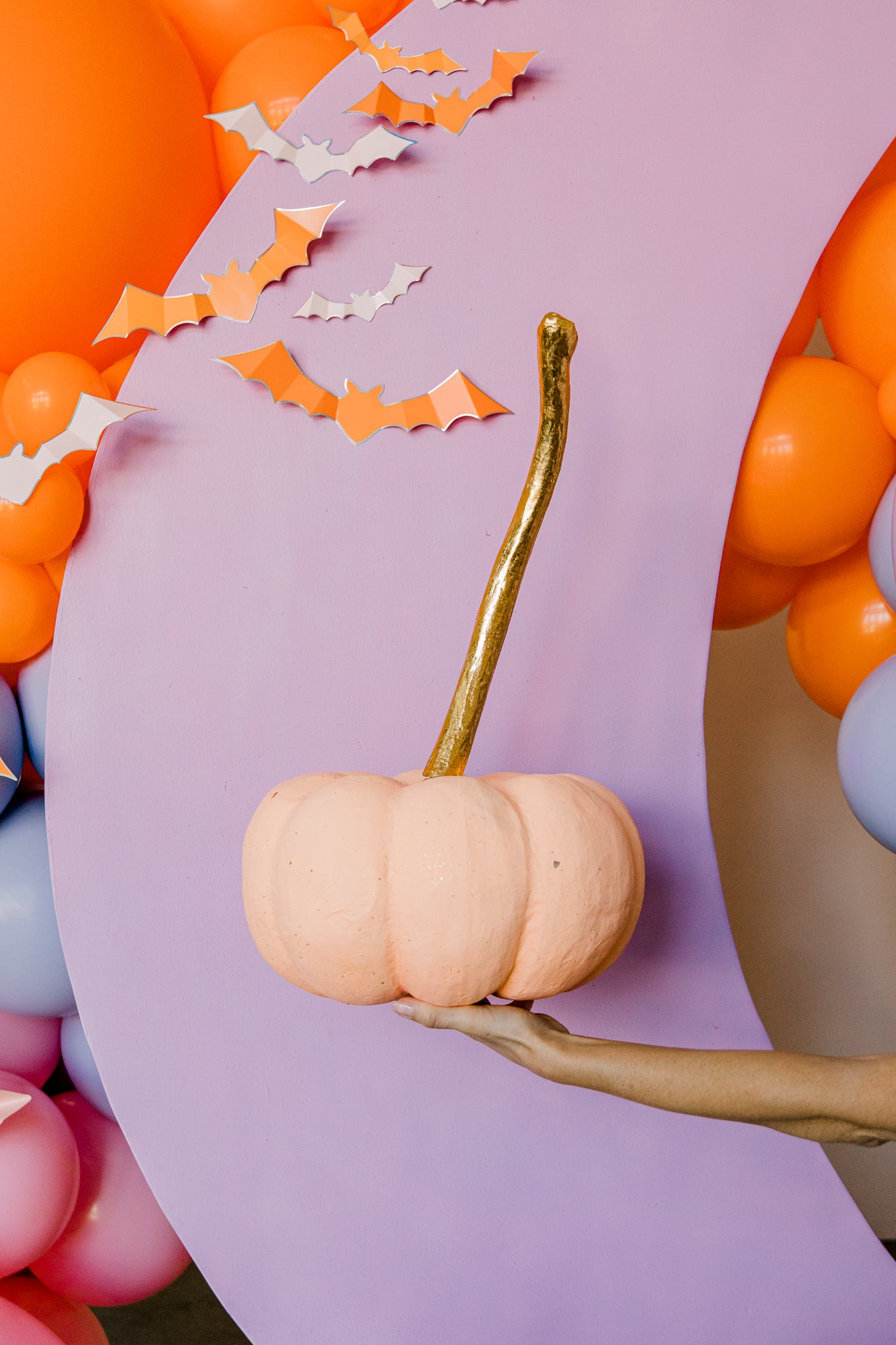 Pink paper mache pumpkin for pink Halloween decor.