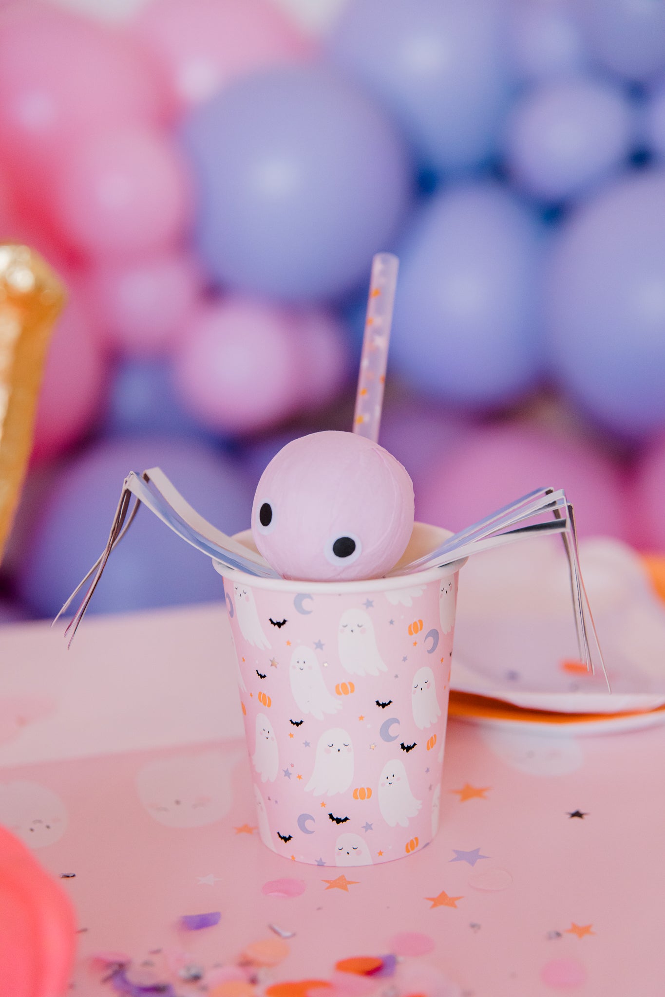 Pastel Halloween party cup and spider surprise ball.