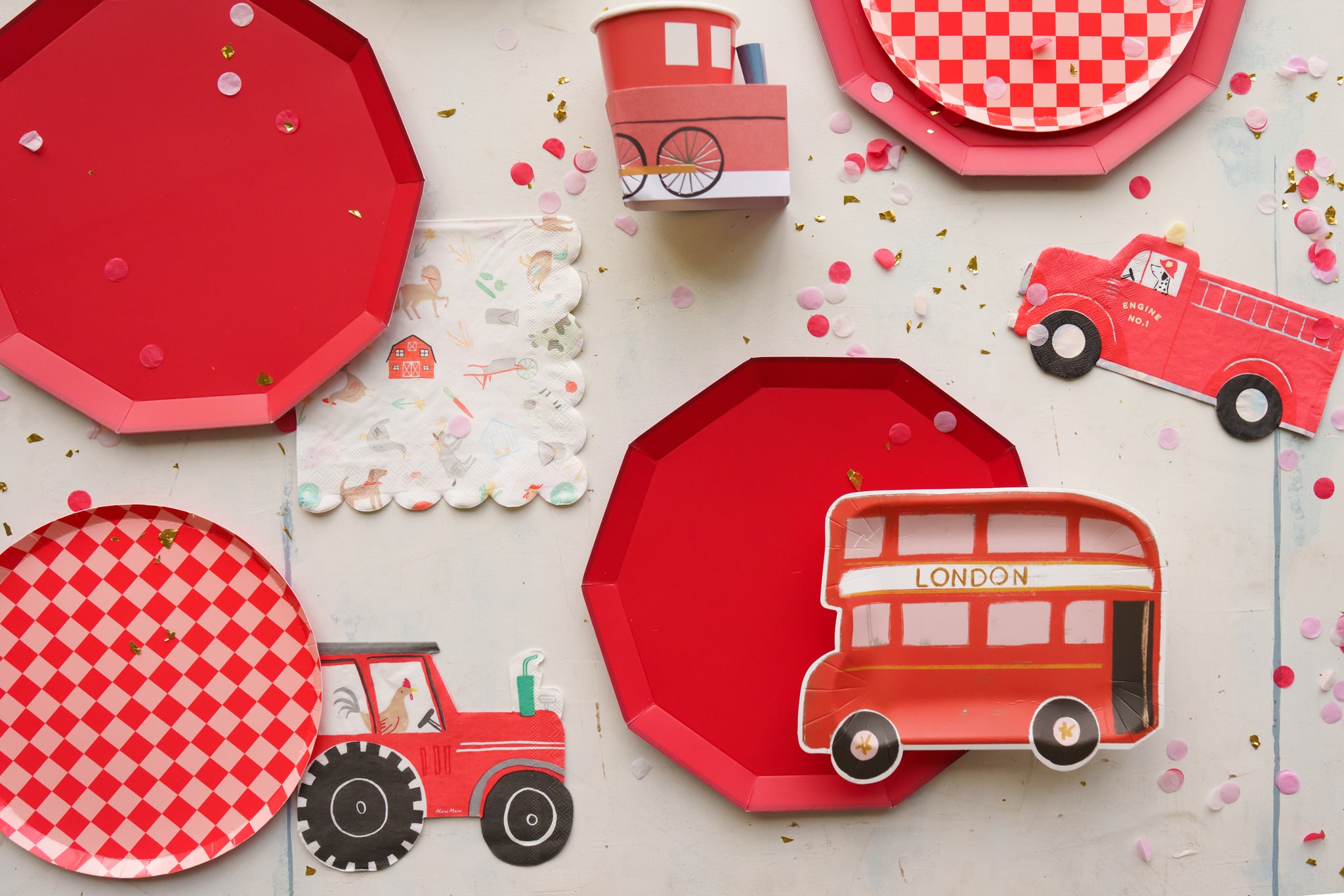 Red paper party plates to use for a vehicle theme party or farm theme party.