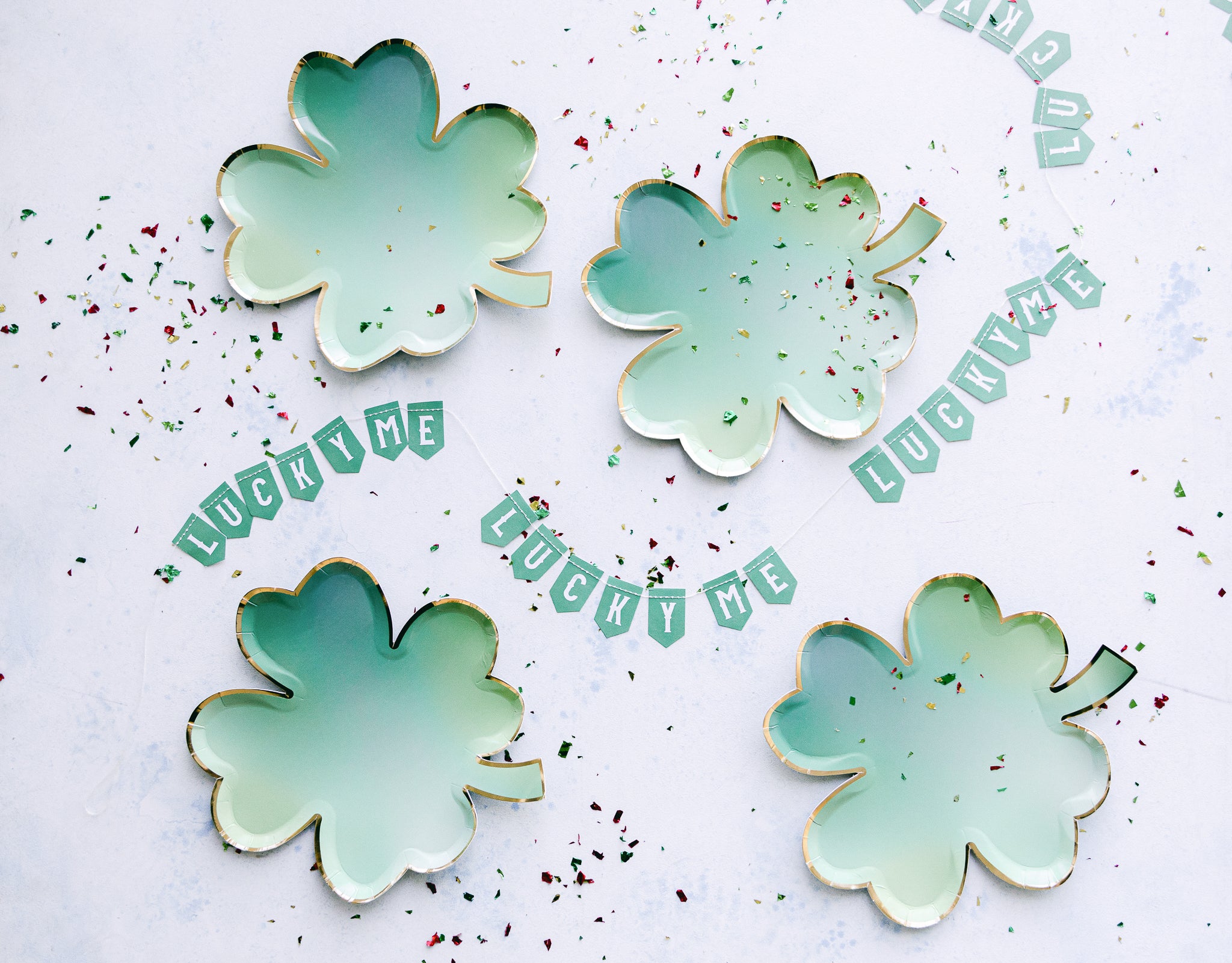 St. Patrick's Day tableware set-up with clover leaf plates