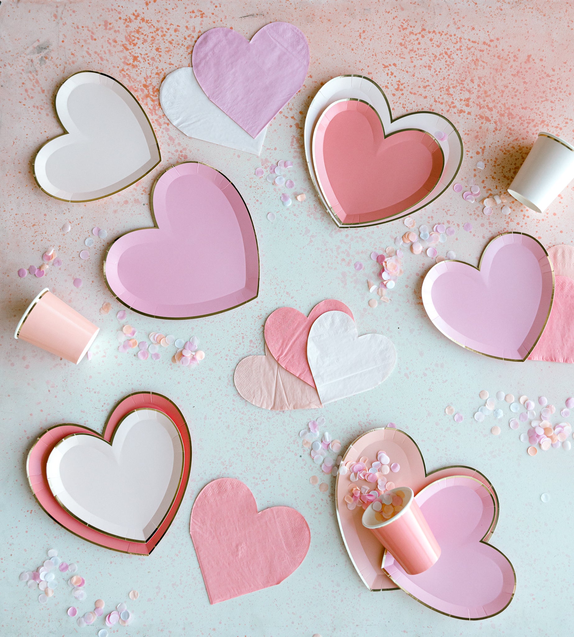 Pink ombre heart plates, cups, and napkins for a Valentine's Day party