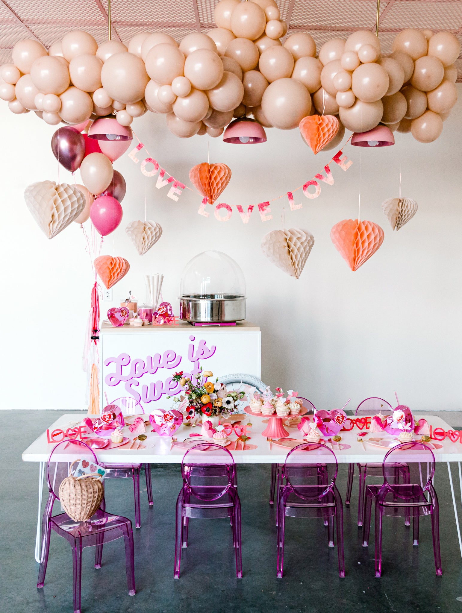 Girls Valentine's Day party set up with pink ombre decorations