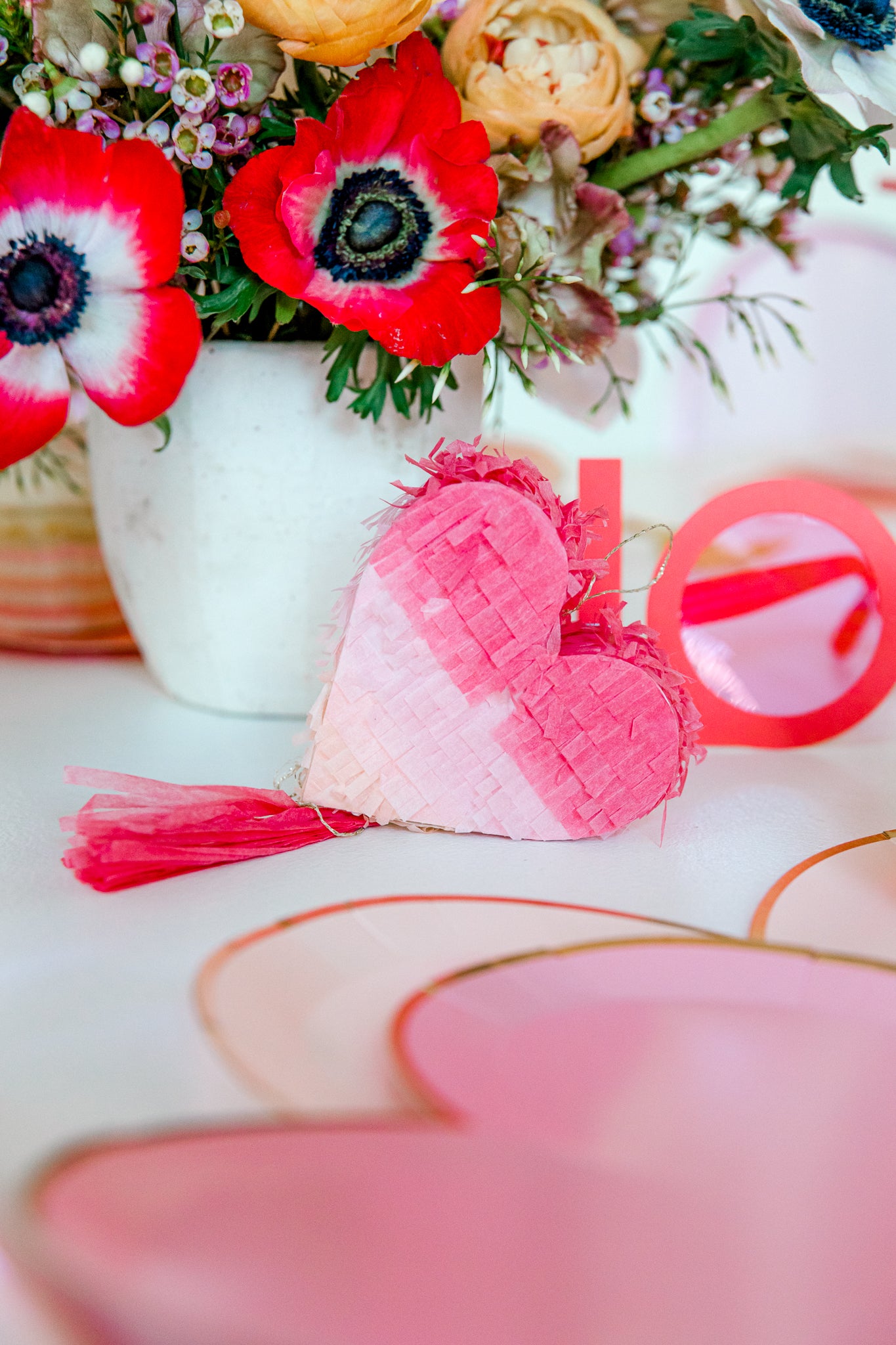 Ombre heart pinatas used as a fun Valentine's Day party favor