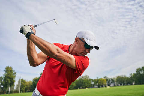 golfer successfully managing neck pain to stay on the course