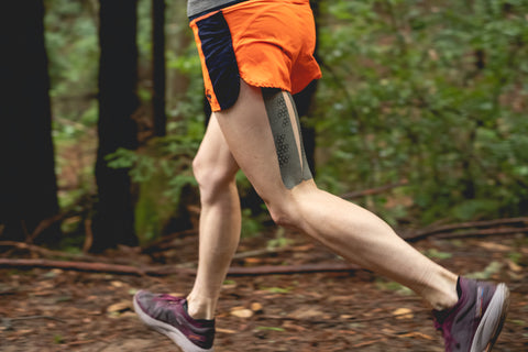 runner on forested trail