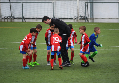 kids soccer team with coach