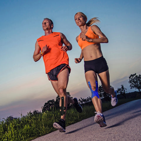 Runners with Kinesiology Tape shin and knee