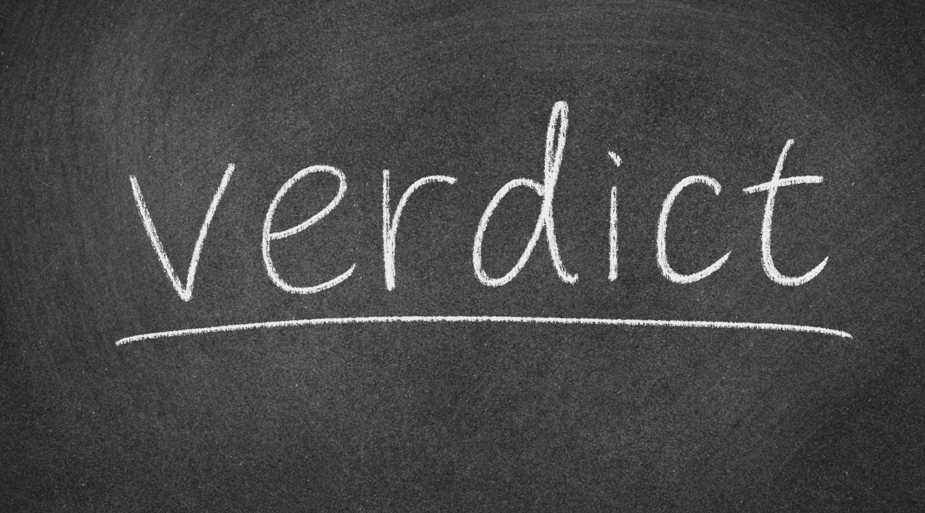 a picture of a chalk board and the word "verdict" written on it in chalk.