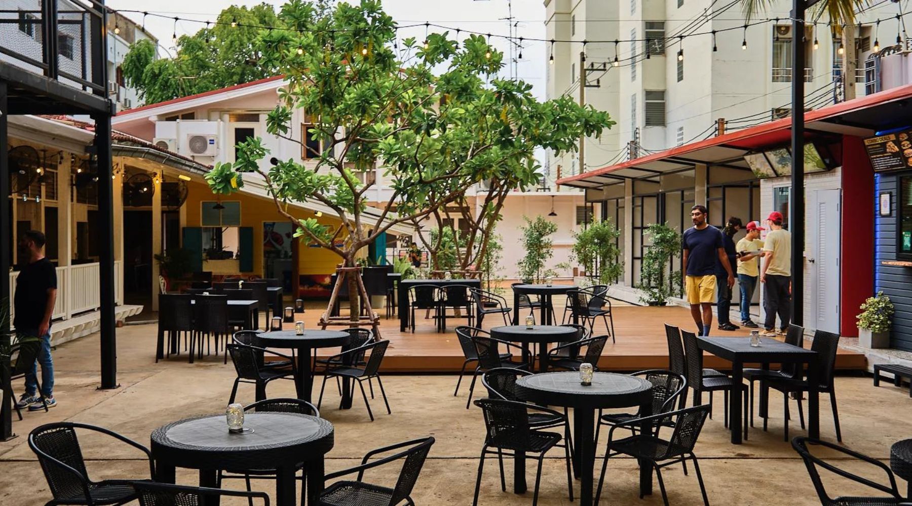 Backyard Bangkok seated area with lots of chairs and tables.