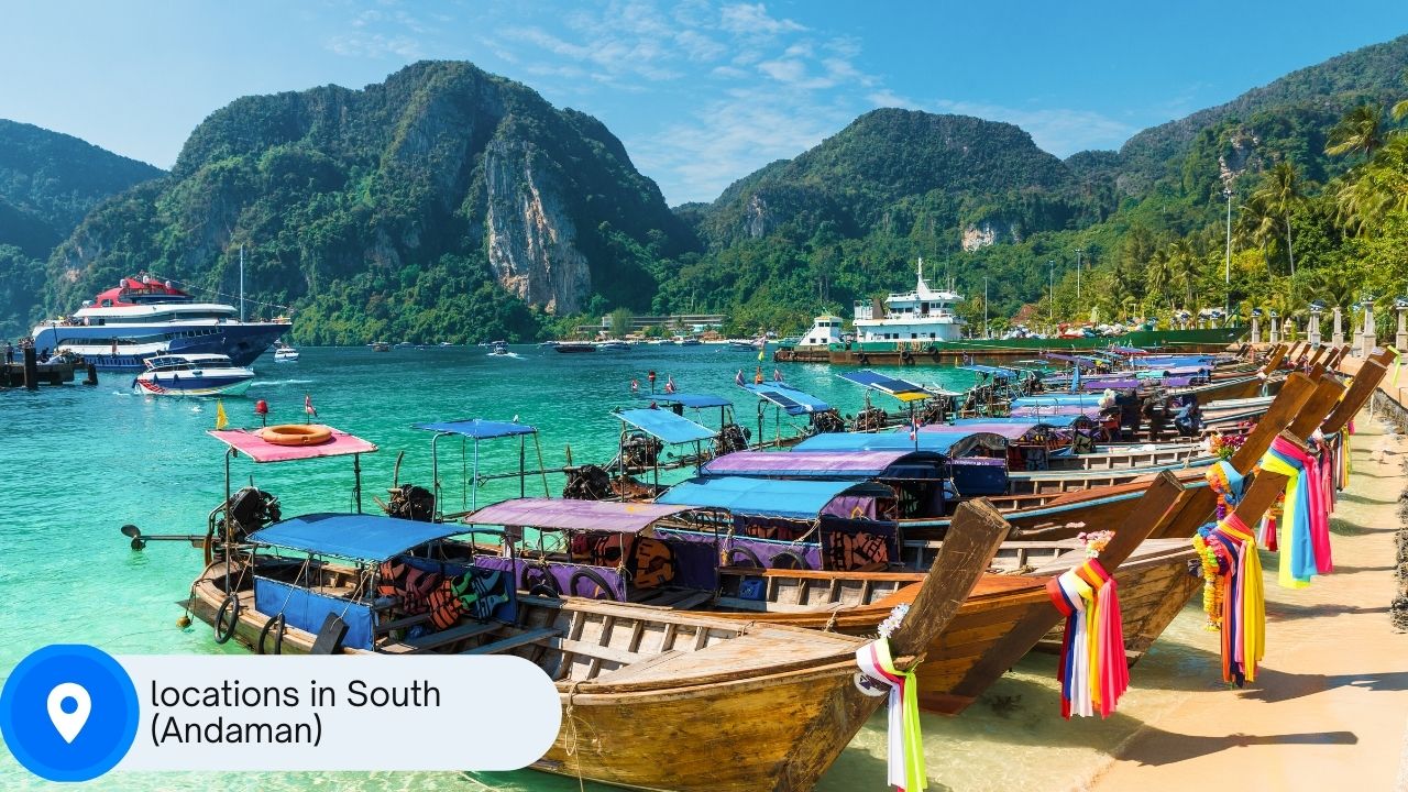 A picture of a beach on Koh Phi Phi with a location sign with the words "locations in the south (Andaman)" written on it.
