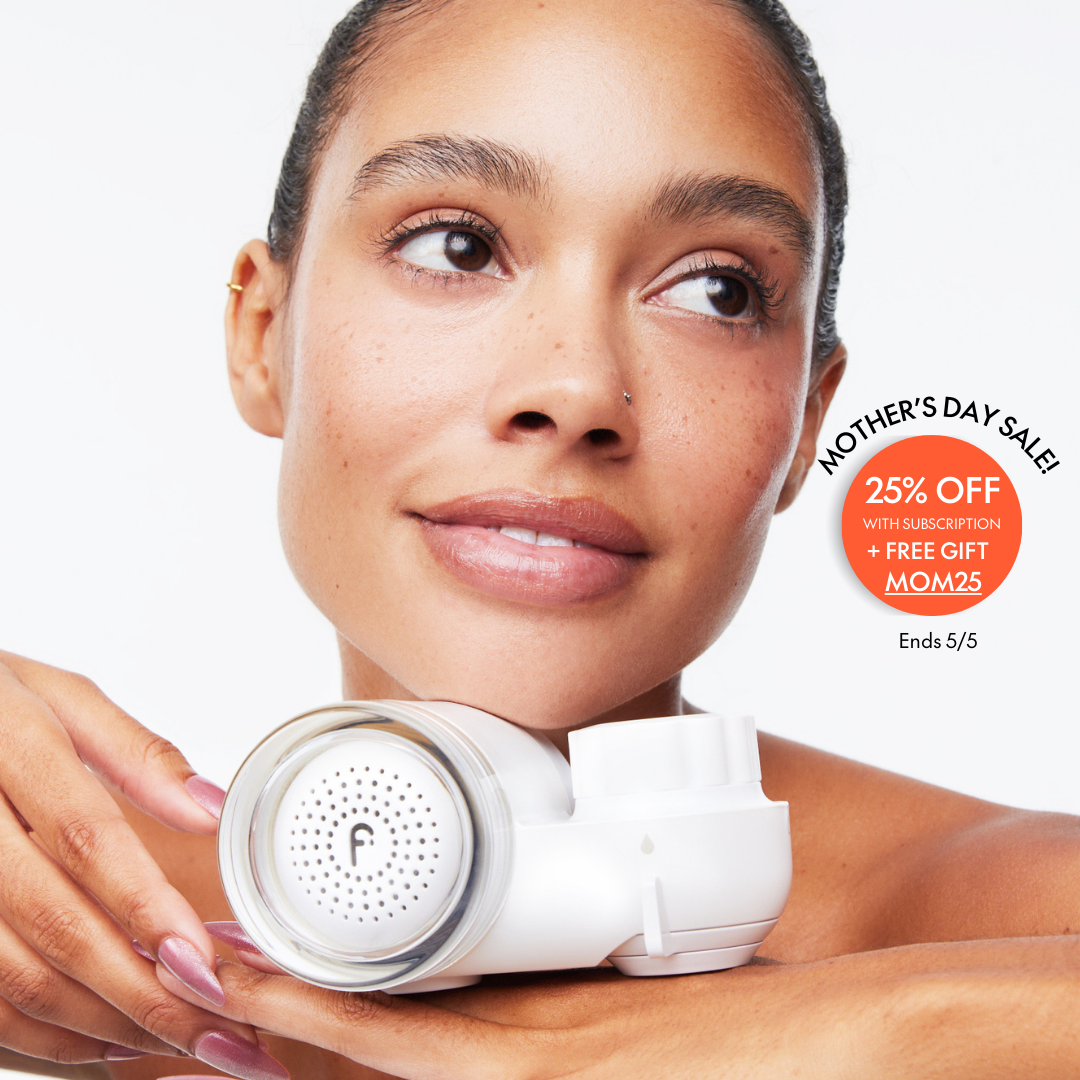 Woman holding a skincare device, with promotional Mother's Day sale text.