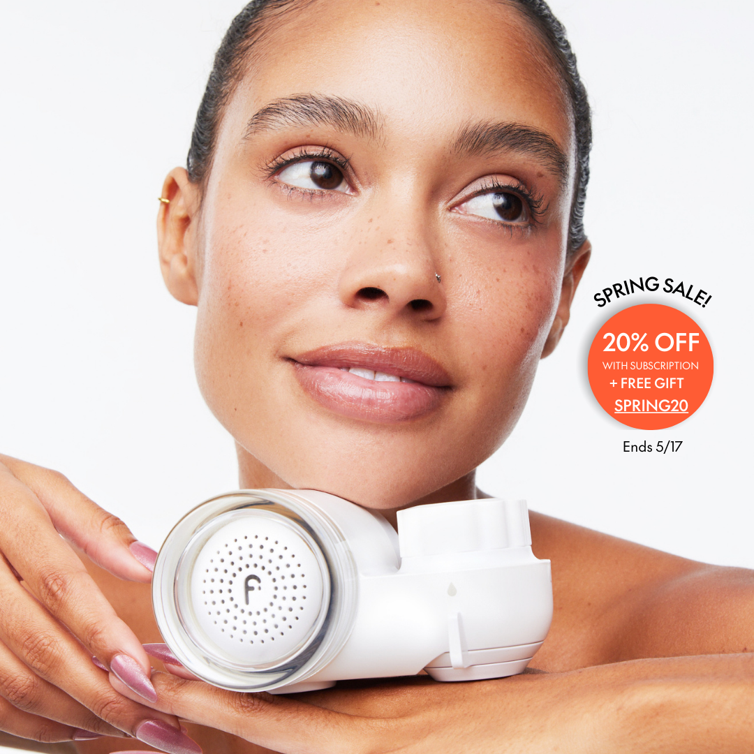 Woman holding a skincare device with promotional text for a spring sale.