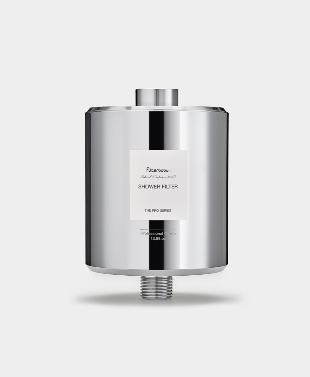 Chrome shower filter with label reading 'Filterbaby x Robert Gaffigan, M.D. Shower Filter, The Pro Series.'