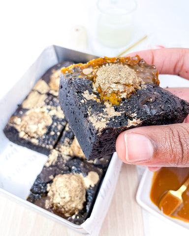 Black woman holding Ferrero Rocher Brownies 