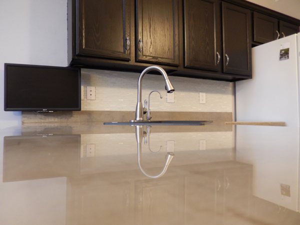 An epoxy kitchen countertop, seen up close at a steep horizontal angle.