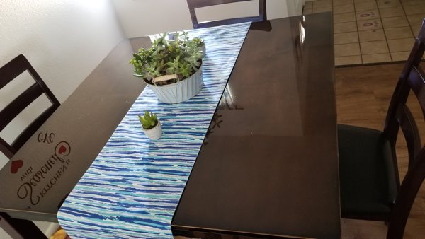 An epoxy resin table top, with a smooth epoxy surface that's easy to clean.